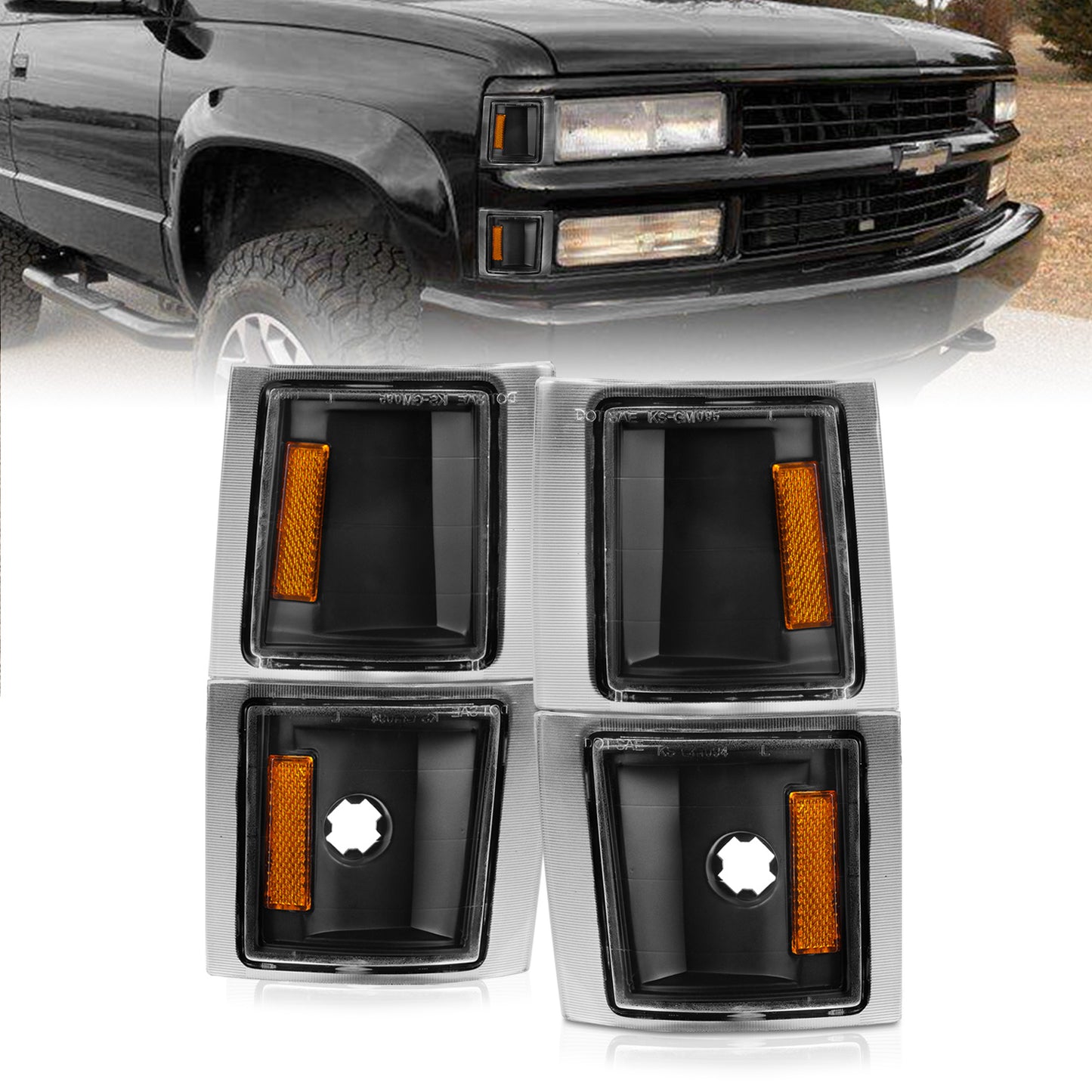 Car fog light covers with orange reflectors in front of a black truck.