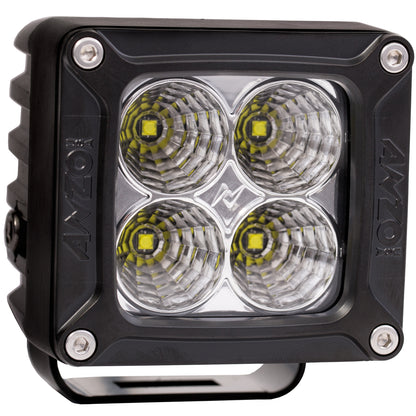 Cube-shaped LED light with four circular lenses and 'AXO' branding on a white background