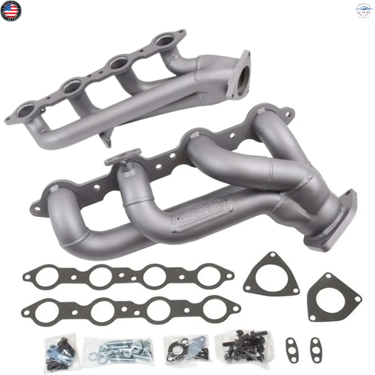 Metal exhaust manifold set with gaskets and bolts on a white background