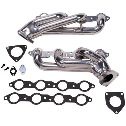 Metal exhaust manifold set with gaskets on a white background