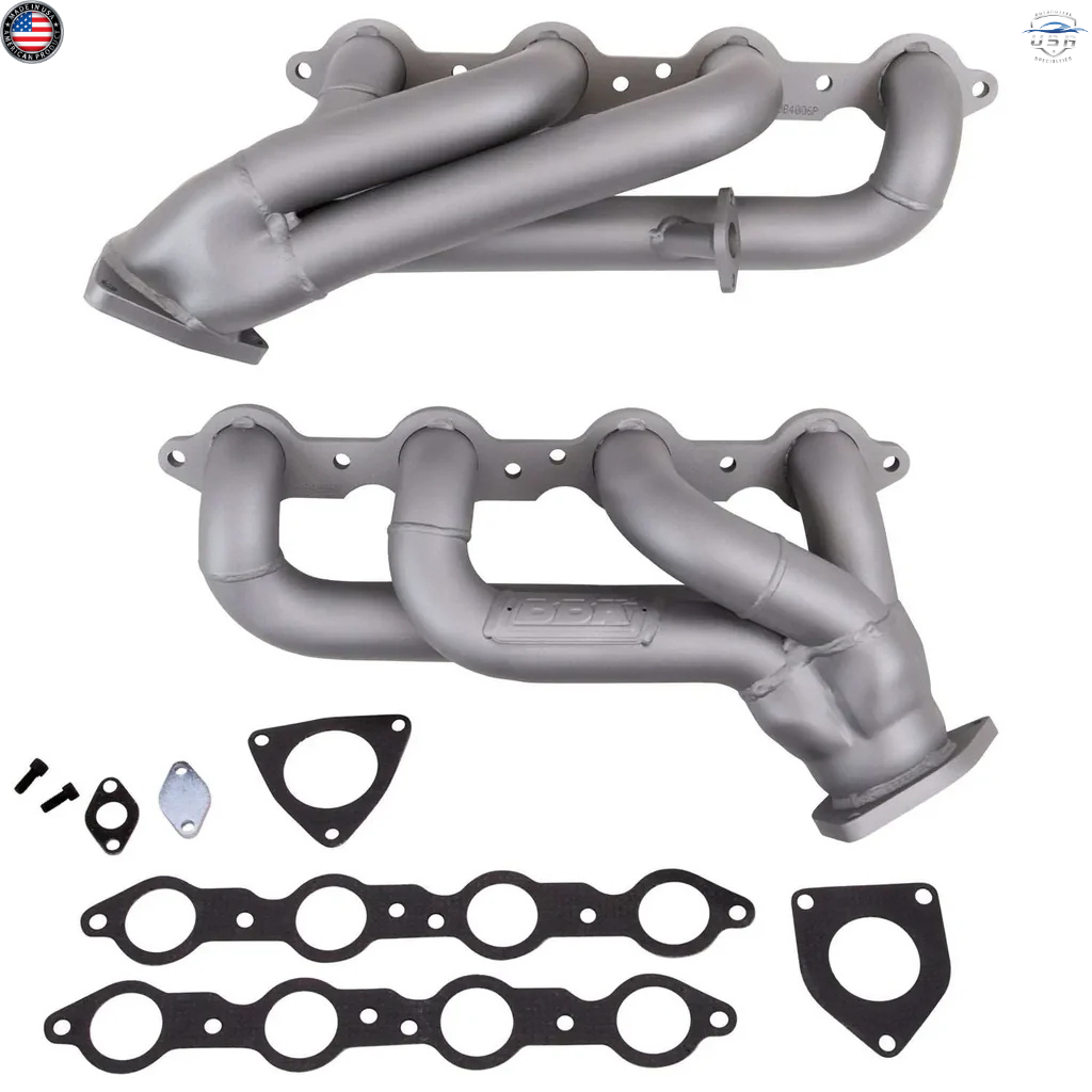 Set of automotive exhaust manifolds with gaskets on a white background