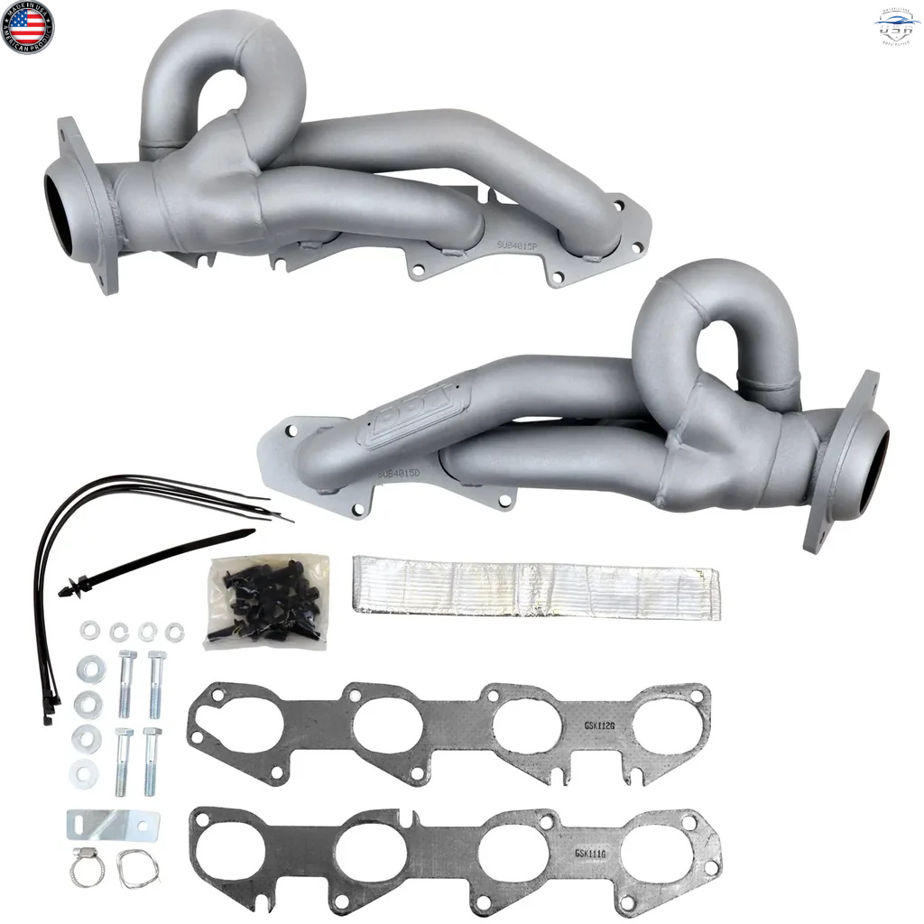 Exhaust manifold kit with pipes, gaskets, and hardware on a white background