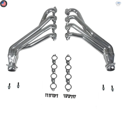 Set of metallic exhaust pipes and gaskets on a white background