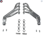 Set of metallic exhaust pipes and gaskets on a white background