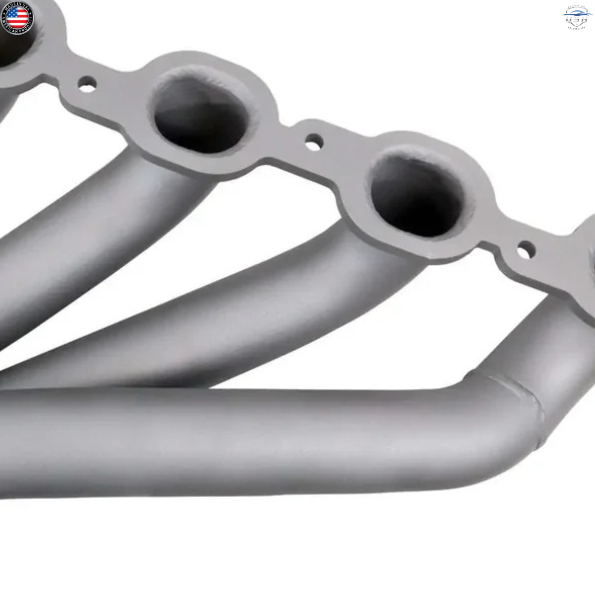 Metallic exhaust manifold on a white background