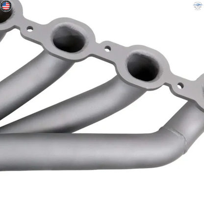Metallic exhaust manifold on a white background