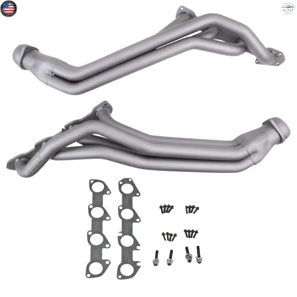 Metal exhaust pipes with gaskets and bolts on a white background