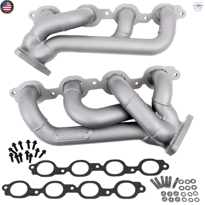 Metal exhaust manifold set with gaskets and bolts on a white background